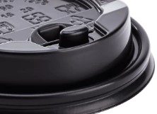 Close-up of black disposable coffee cup lid